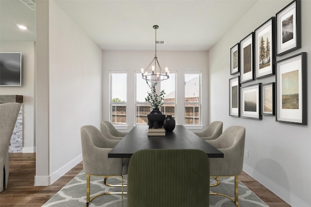 7709 Potter St, Rowlett, TX 75089 - dining area with a chandelier and wood finished floors
