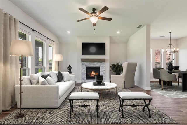 7709 Potter St, Rowlett, TX 75089 - living area with wood finished floors, a fireplace, ceiling fan, a chandelier, and recessed lighting