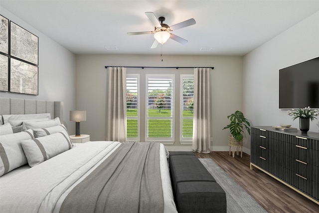 7709 Potter St, Rowlett, TX 75089 - bedroom with dark wood-type flooring and ceiling fan