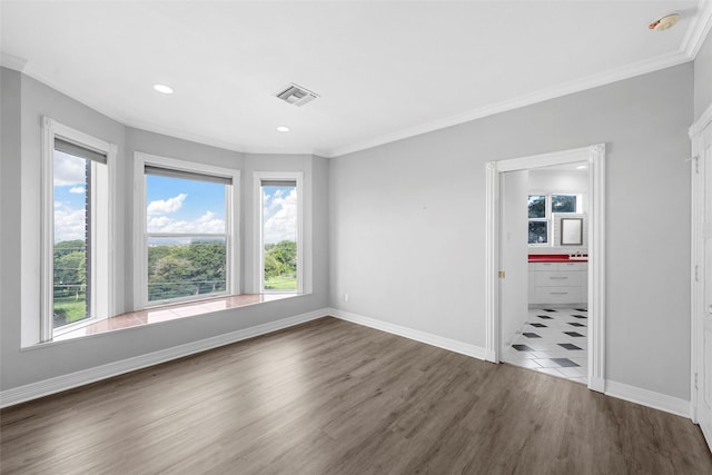 308 Westlane Cir, Woodway, TX 76712 - spare room with plenty of natural light, ornamental molding, wood finished floors, a smoke detector, and recessed lighting