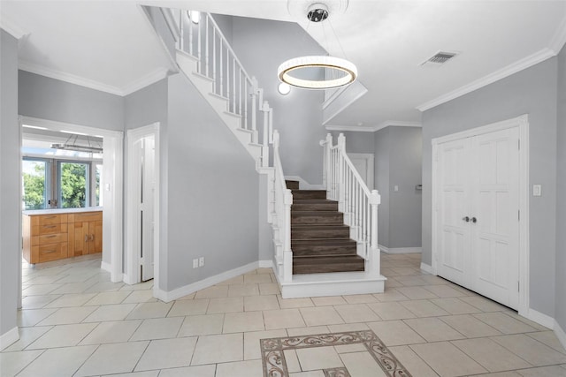 308 Westlane Cir, Woodway, TX 76712 - entrance foyer with stairway, crown molding, light tile patterned flooring, and a chandelier