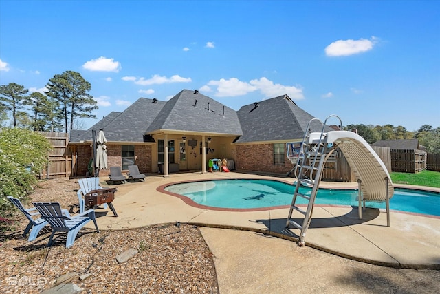 2018 Honeytree Trl, Haughton, LA 71037 - view of pool featuring a water slide, a patio area, and a fenced backyard