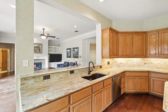 1308 Lakeway Dr, Southlake, TX 76092 - kitchen featuring stainless steel dishwasher, ceiling fan, dark wood-type flooring, light stone countertops, and a premium fireplace