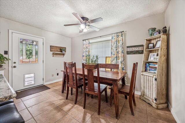 4201 Ravenhill Ln, Arlington, TX 76016 - dining area with a ceiling fan, a textured ceiling, and light tile patterned flooring
