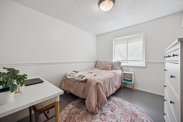 4201 Ravenhill Ln, Arlington, TX 76016 - bedroom featuring finished concrete floors and a textured ceiling