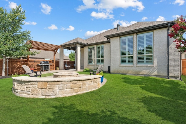 14845 Belclaire Ave, Aledo, TX 76008 - back of house with a patio, a fenced backyard, brick siding, an outdoor fire pit, and roof with shingles
