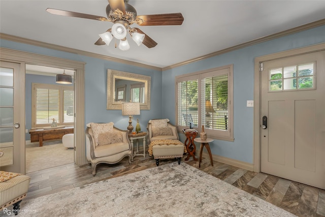 9900 Myrtis Texas Line Rd, Vivian, LA 71082 - entrance foyer featuring crown molding, plenty of natural light, a ceiling fan, and wood finished floors