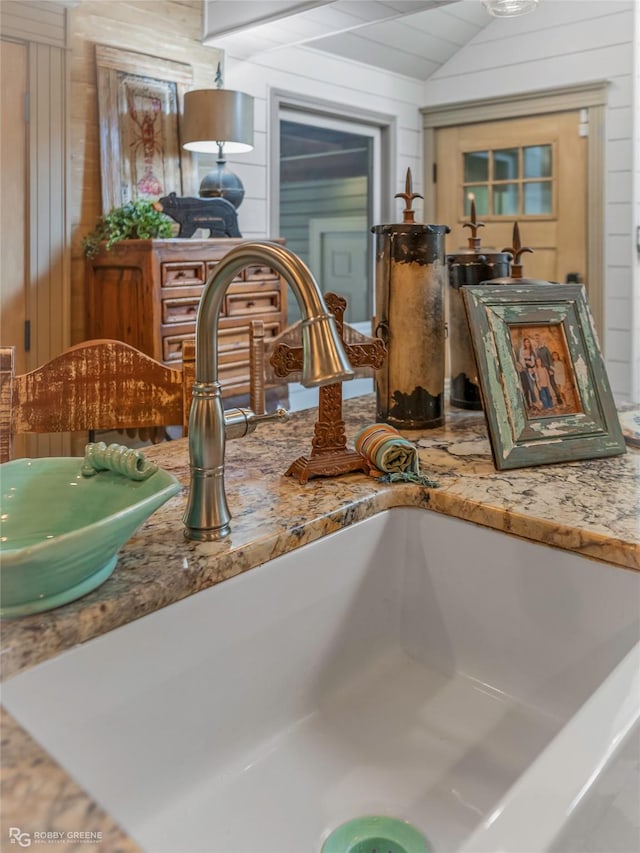 9900 Myrtis Texas Line Rd, Vivian, LA 71082 - kitchen view of wood walls and stone counters