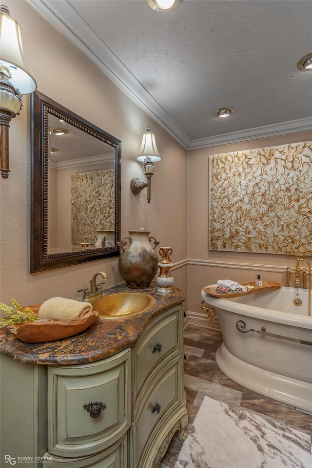 9900 Myrtis Texas Line Rd, Vivian, LA 71082 - full bath featuring ornamental molding, a freestanding tub, vanity, recessed lighting, and a textured ceiling