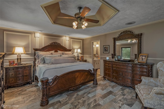 9900 Myrtis Texas Line Rd, Vivian, LA 71082 - bedroom with a decorative wall, connected bathroom, stone finish flooring, and a ceiling fan