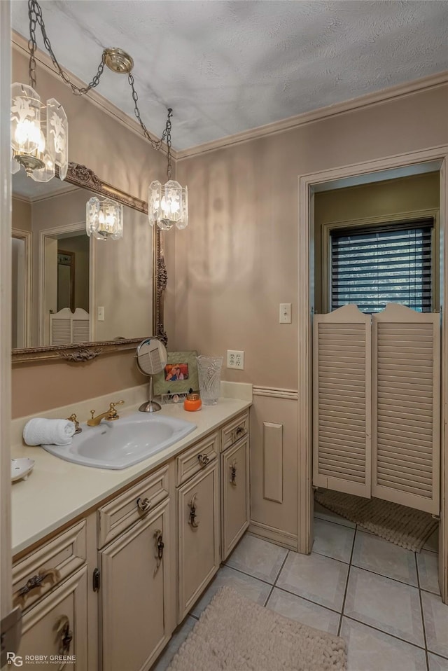 9900 Myrtis Texas Line Rd, Vivian, LA 71082 - bathroom featuring crown molding, vanity, tile patterned flooring, and a chandelier