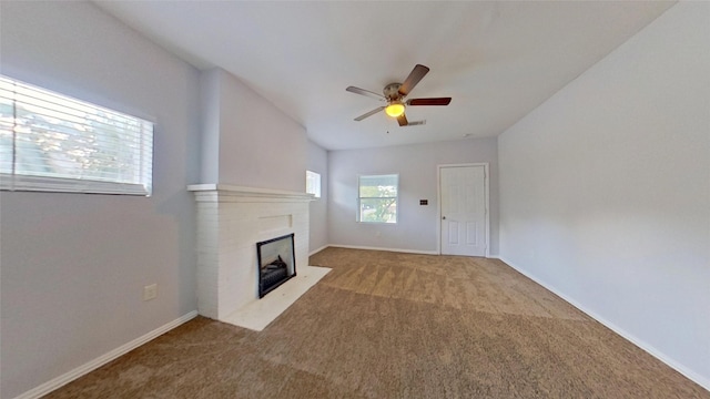2700 S Jones St, Fort Worth, TX 76104 - unfurnished living room featuring ceiling fan, carpet flooring, and a brick fireplace