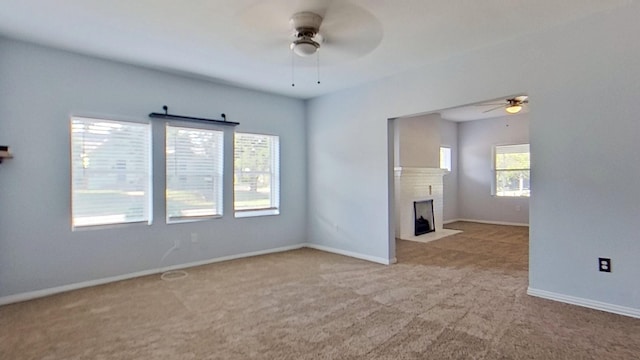 2700 S Jones St, Fort Worth, TX 76104 - unfurnished room with ceiling fan, carpet, and a fireplace with flush hearth