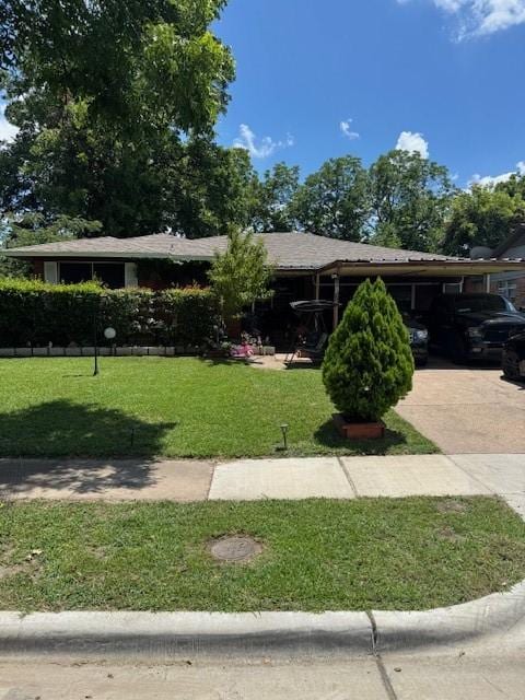 8730 Blossom Ln, Dallas, TX 75227 - view of front of property featuring a front lawn, driveway, and an attached carport