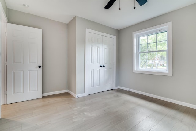 331 Andover Dr, Mesquite, TX 75149 - unfurnished bedroom featuring light wood finished floors, a closet, and a ceiling fan
