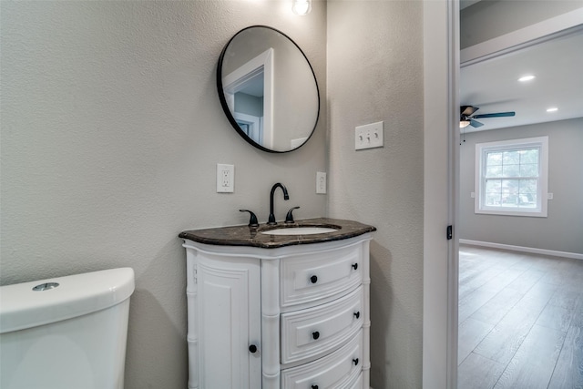 331 Andover Dr, Mesquite, TX 75149 - bathroom with vanity, ceiling fan, wood finished floors, and a textured wall
