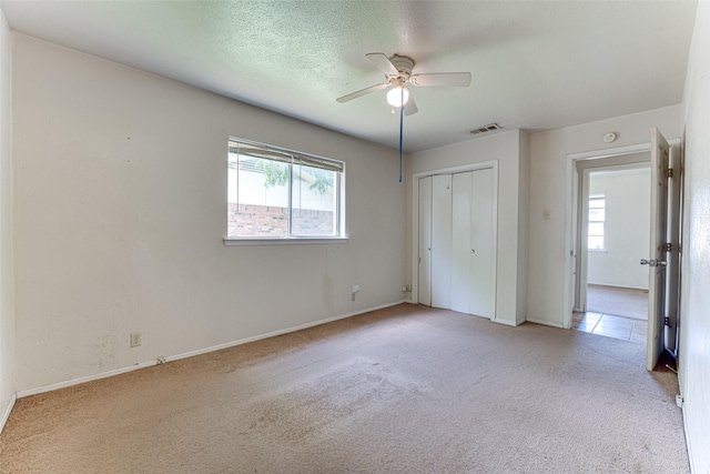 3000 Lambert Dr, Mesquite, TX 75150 - unfurnished bedroom featuring carpet floors, multiple windows, and a closet