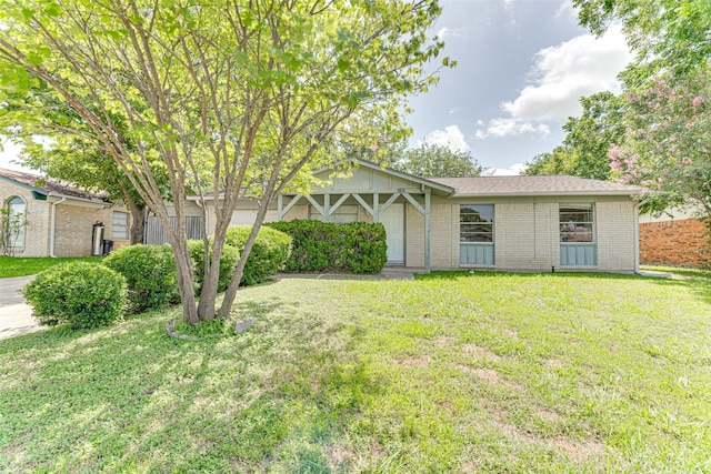 3000 Lambert Dr, Mesquite, TX 75150 - view of front facade with a front yard and brick siding