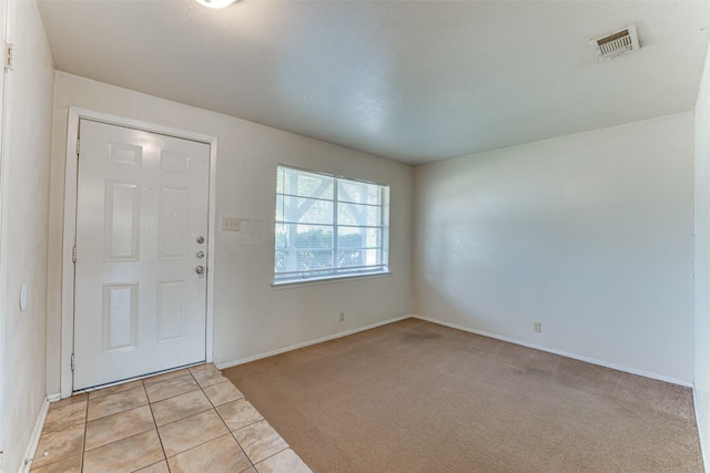 3000 Lambert Dr, Mesquite, TX 75150 - foyer featuring light colored carpet and light tile patterned flooring