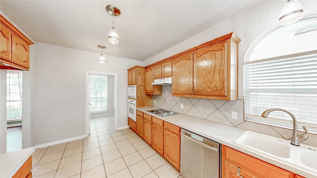 4009 Bickmore Ln, Fort Worth, TX 76244 - kitchen featuring white appliances, under cabinet range hood, decorative backsplash, light countertops, and decorative light fixtures