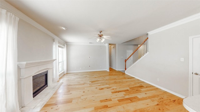4009 Bickmore Ln, Fort Worth, TX 76244 - unfurnished living room with ceiling fan, ornamental molding, stairway, a fireplace, and light wood-style flooring