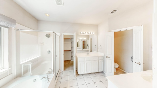 4009 Bickmore Ln, Fort Worth, TX 76244 - full bathroom featuring vanity, tile patterned floors, a stall shower, a walk in closet, and a bath
