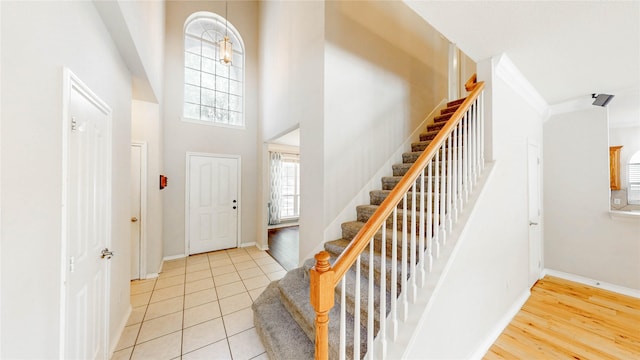 4009 Bickmore Ln, Fort Worth, TX 76244 - entrance foyer with plenty of natural light, stairway, a towering ceiling, and light tile patterned flooring