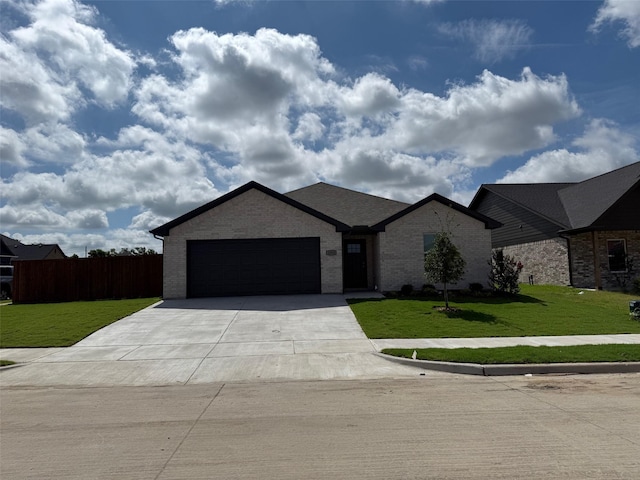 1803 Boxwood Dr, Sherman, TX 75092 - view of front of home with concrete driveway, a garage, and brick siding