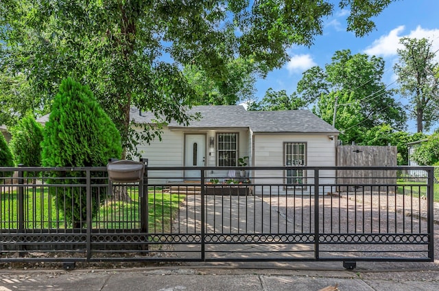 2020 Skylark Dr, Dallas, TX 75216 - view of front of house featuring roof with shingles, a gate, and a fenced front yard