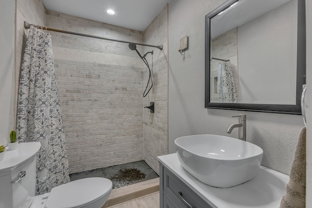 2020 Skylark Dr, Dallas, TX 75216 - bathroom with vanity, a tile shower, and a textured wall