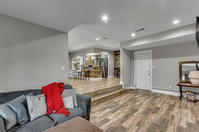 2020 Skylark Dr, Dallas, TX 75216 - living area featuring wood finished floors, recessed lighting, and vaulted ceiling