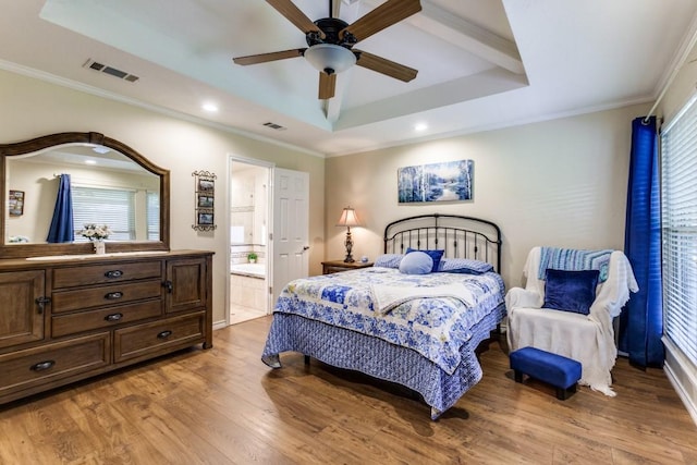 2514 Golden Oaks Dr, Garland, TX 75044 - bedroom featuring a raised ceiling, light wood-style floors, crown molding, recessed lighting, and ensuite bath