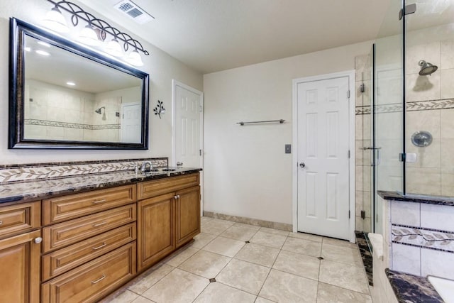 2514 Golden Oaks Dr, Garland, TX 75044 - bathroom with a stall shower, vanity, and tile patterned flooring