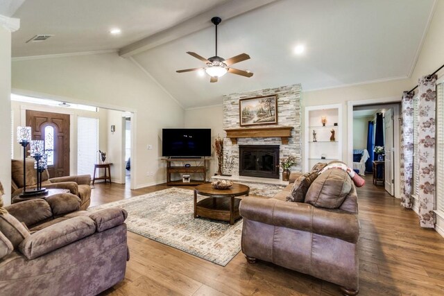 2514 Golden Oaks Dr, Garland, TX 75044 - living area featuring wood finished floors, a stone fireplace, and ceiling fan