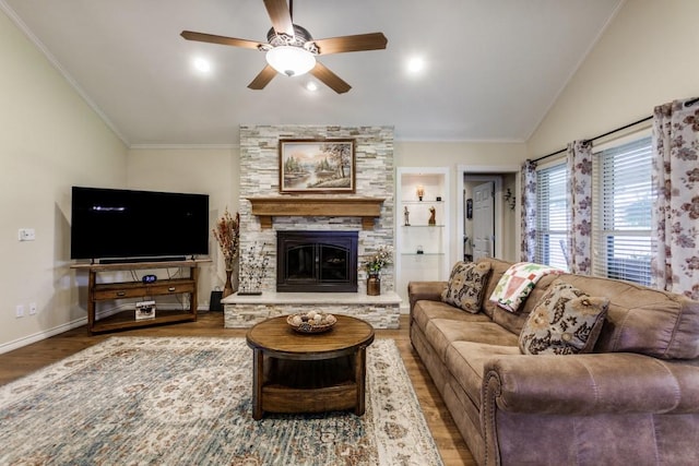 2514 Golden Oaks Dr, Garland, TX 75044 - living room featuring wood finished floors, lofted ceiling, ornamental molding, ceiling fan, and a stone fireplace