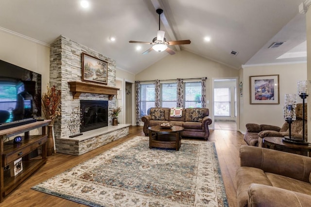 2514 Golden Oaks Dr, Garland, TX 75044 - living area with a stone fireplace, wood finished floors, a ceiling fan, and crown molding