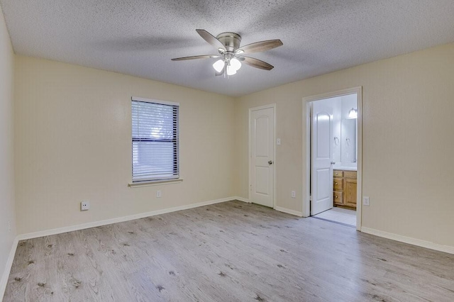 8 Ventnor Ave, Midlothian, TX 76065 - unfurnished room with wood finished floors, ceiling fan, and a textured ceiling