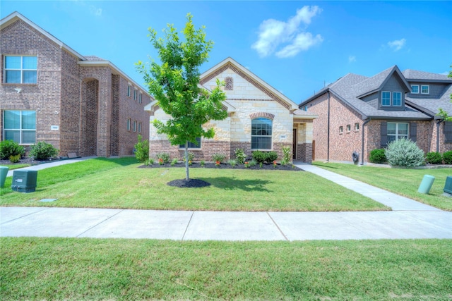 1113 Milfoil Dr, Justin, TX 76247 - view of front of house featuring a front lawn and brick siding