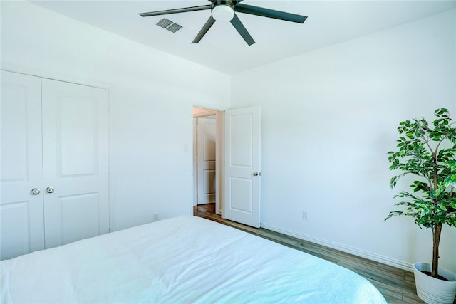1113 Milfoil Dr, Justin, TX 76247 - bedroom featuring wood finished floors, a ceiling fan, and a closet