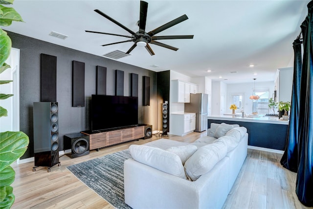 1113 Milfoil Dr, Justin, TX 76247 - living area featuring a ceiling fan, light wood finished floors, and recessed lighting
