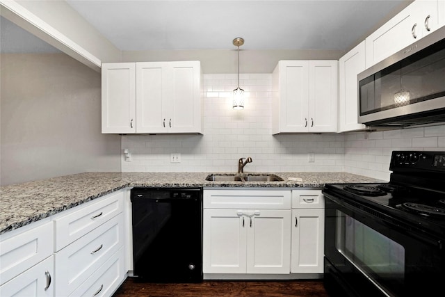 7828 Cardinal Ct 7824, North Richland Hills, TX 76180 - kitchen with black appliances, white cabinetry, and backsplash