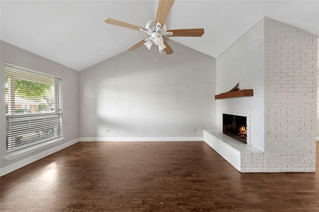 7828 Cardinal Ct 7824, North Richland Hills, TX 76180 - unfurnished living room with a brick fireplace, lofted ceiling, wood finished floors, and a ceiling fan