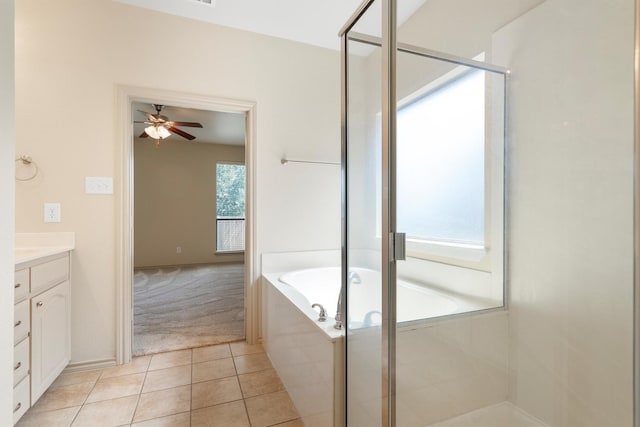 3228 Buckthorn Ln, Denton, TX 76226 - full bath featuring vanity, a bath, ceiling fan, a stall shower, and tile patterned floors