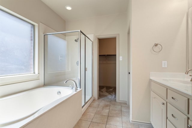 3228 Buckthorn Ln, Denton, TX 76226 - full bath featuring a shower stall, a bath, vanity, a walk in closet, and tile patterned flooring