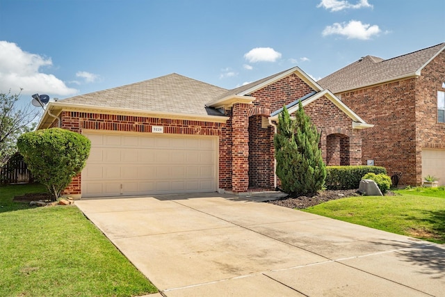 3228 Buckthorn Ln, Denton, TX 76226 - view of front of property with brick siding, a shingled roof, and a garage