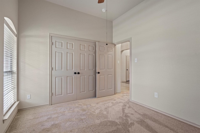 3228 Buckthorn Ln, Denton, TX 76226 - unfurnished bedroom featuring carpet flooring, multiple windows, a closet, and a ceiling fan