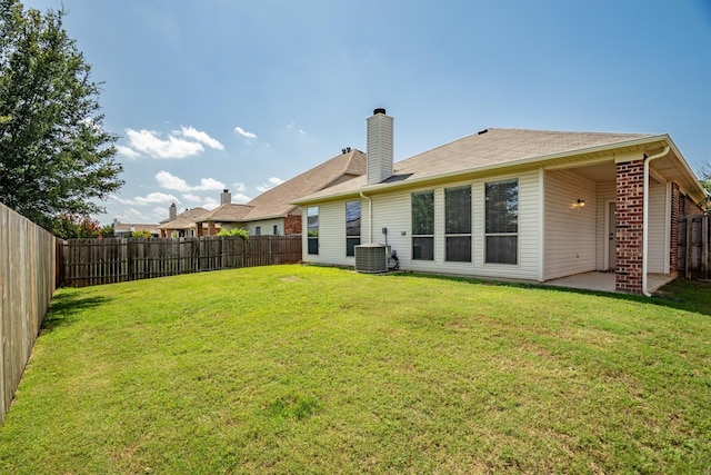 3228 Buckthorn Ln, Denton, TX 76226 - back of house featuring a fenced backyard, a chimney, a patio area, and brick siding