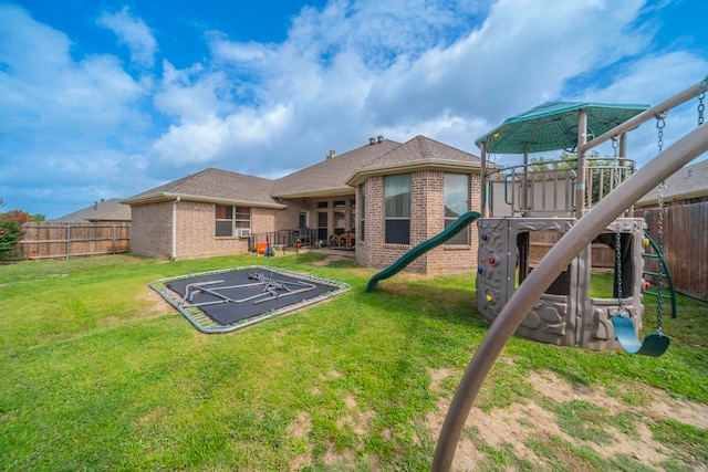 5872 Nathaniel Dr, Fort Worth, TX 76179 - rear view of house featuring a playground, brick siding, a fenced backyard, and roof with shingles