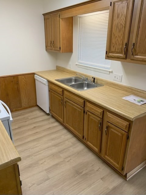 304 Lakeview St, Whitehouse, TX 75791 - kitchen with white dishwasher, light wood-style flooring, brown cabinets, and stove