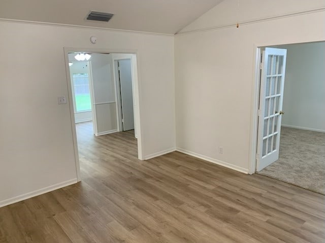 304 Lakeview St, Whitehouse, TX 75791 - empty room with wood finished floors and vaulted ceiling